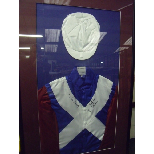 796 - The silks and jockey cap of One for Arthur, the winner of the Grand National 2017, signed by Lucinda... 