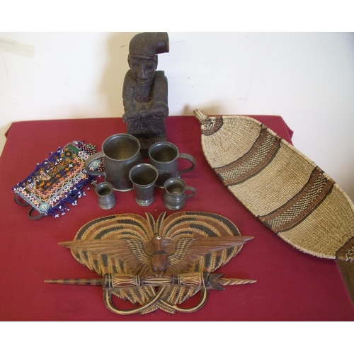 122 - Selection of various pewter Tudric tankards, carved wood tribal style figure, similar beadwork pouch... 