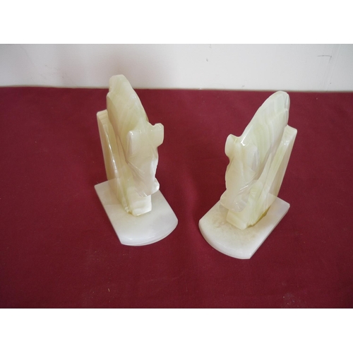125 - Pair of onyx horse head bookends, a Sheffield silver hallmarked pickle fork, a leather book shaped b... 