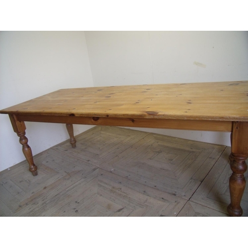 332 - Rectangular pine kitchen table on turned supports (91cm x 213cm)