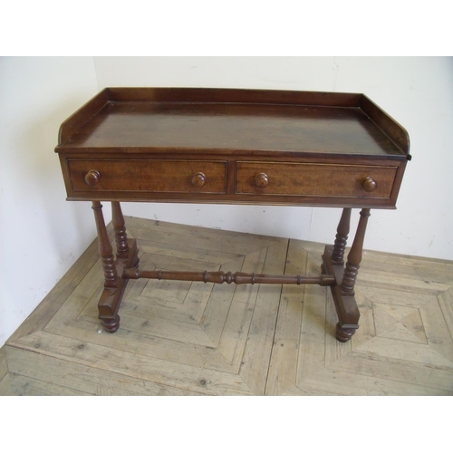 333 - 19th C mahogany two drawer side table with raised back and sides on turned supports and cross stretc... 
