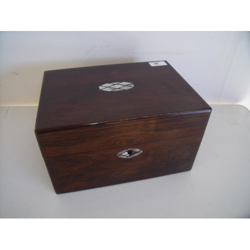40 - Rosewood and Mother of Pearl inlaid dressing table box, the hinged lid revealing fitted interior wit... 