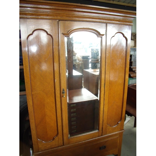 431 - Edwardian light oak wardrobe enclosed by single bevelled edge mirror door with single drawer to the ... 