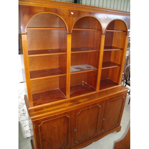 436 - Modern yew wood side cabinet with three sectional multi tier top above three panelled cupboard doors... 