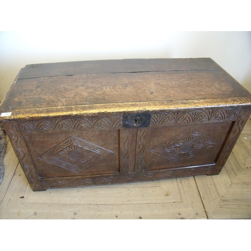 442 - Oak coffer with hinged rectangular lid above carved and panelled front (106cm x 48cm x 50cm)