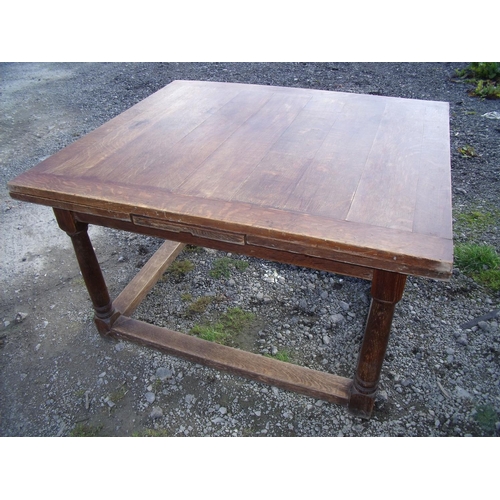 445 - Early 20th C oak drawer leaf extending dining table on turned supports (minimum length 124cm)