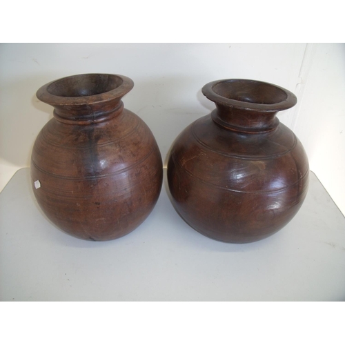 52 - Pair of turned wood African tribal style vases with flare circular rims (30cm high)