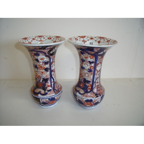 65 - Pair of Imari pattern vases with flared rims (21.5cm high) (1 x hairline crack)