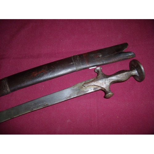 105 - Indian Tulwar sword with 29 inch curved blade, the steel grip and crosspiece with traces of white an... 