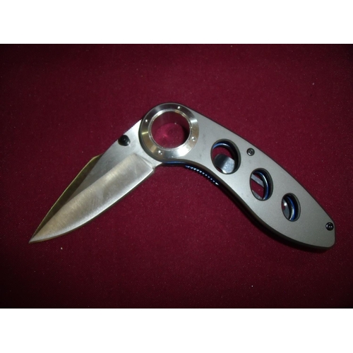 111 - Boxed as new pocket knife with folding 2 3/4 inch blade with belt hook