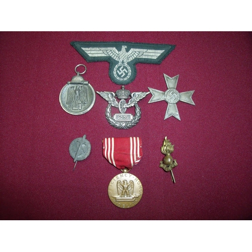 2 - Group of mostly German related military badges, medals etc including cross, Winterschlacht Im Osten ... 