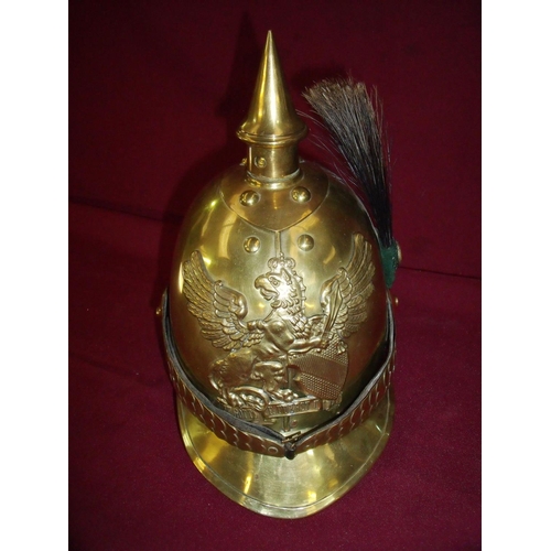 40 - Brass German military style helmet with crowned griffin crest and side hackle, with scale chin strap... 