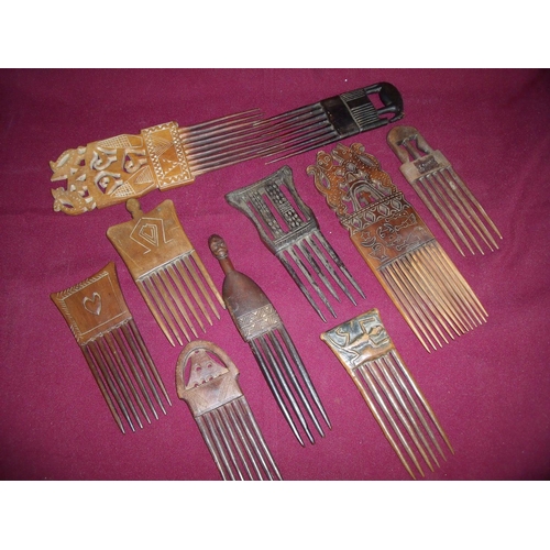 51 - Group of ten carved wood African tribal style combs and hair pieces of various designs
