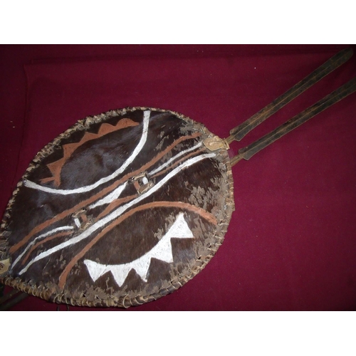 53 - Ashanti hide type shield and two spear with long bladed tips and pointed iron ends