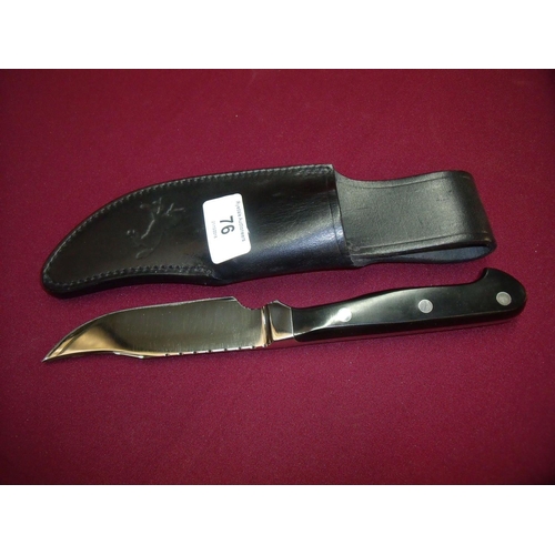 76 - 4.5 inch bladed skinning knife stamped USA with two piece grips complete with a colt leather sheath