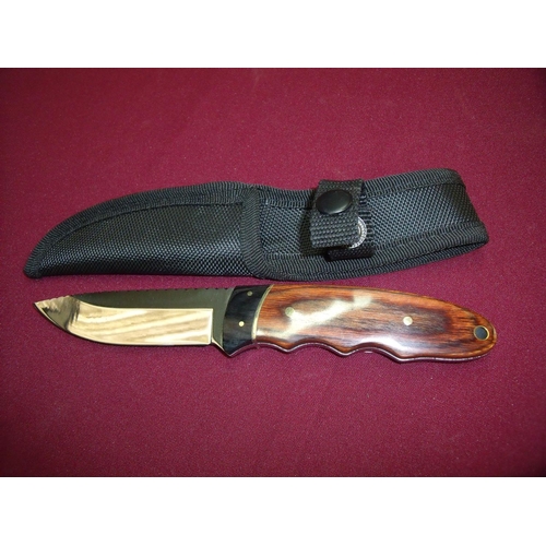 78 - Modern 4 inch bladed sheath knife with two piece wooden grips and canvas sheath