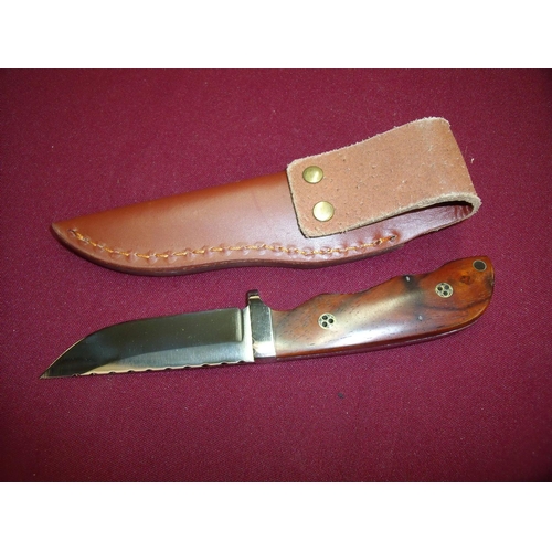 86 - 3 1/4 inch sheath knife with two piece wooden grips and leather sheath