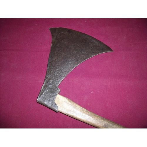 99 - Extremely large iron bladed axe on short wood shaft (length of axe cutting edge 12 inches)