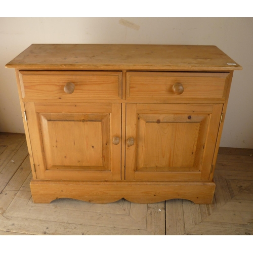 363 - Waxed pine side cabinet with two drawers above two panelled cupboard doors (106cm x 42cm x 84cm)