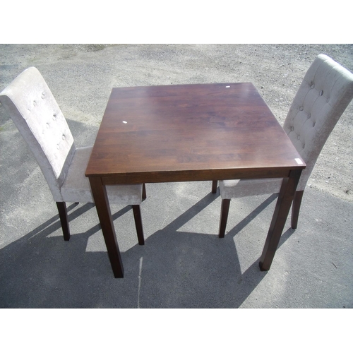 374 - Modern mahogany square dining table on square supports and two upholstered chairs