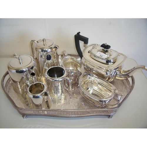 12 - Silver plated three piece tea service and a four piece silver plated coffee service on silver plated... 