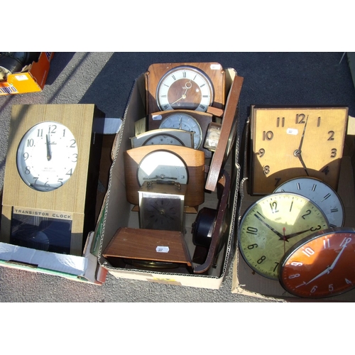 322 - Meiko 400 day transistor clock, two Metamec wall clocks and a selection of electric mantel clocks