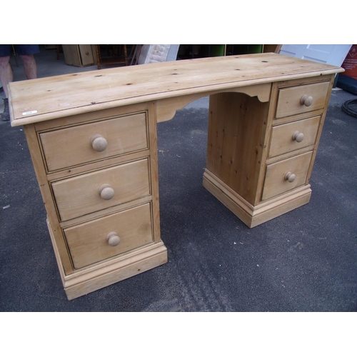 355 - Waxed pine twin pedestal kneehole dressing chest with three drawers to each pedestal, with raised de... 