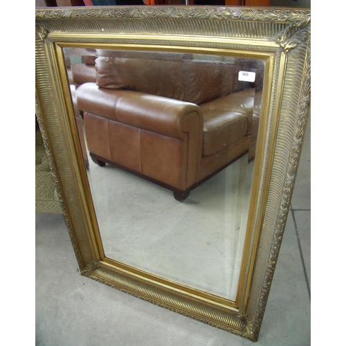 385 - Gilt framed rectangular bevelled edged wall mirror (82cm x 115cm)