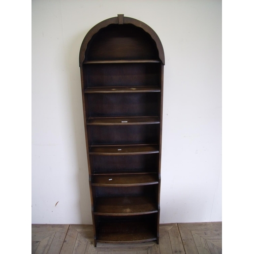 425 - Dark wood waterfall bookcase with arched top