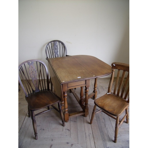 429 - Early 20th C oak drop leaf gate leg table, four wheel back chairs and a rustic elm country chair