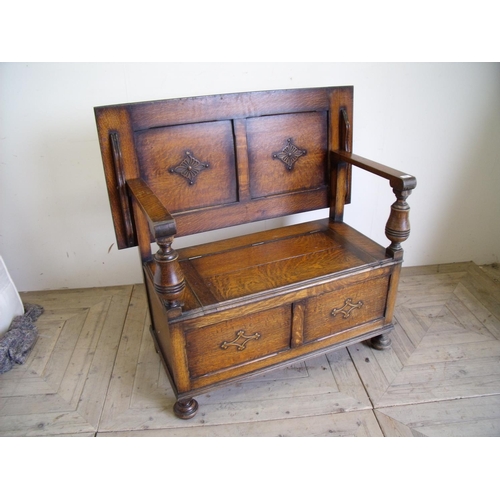 432 - Early 20th C oak monks bench with applied carved detail