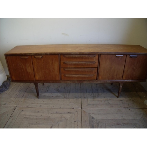 435 - Mid 20th C teak sideboard with four drawers enclosed by two cupboards (width 212cm)