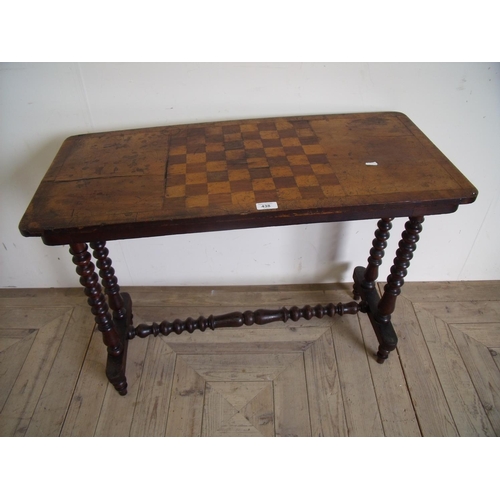 438 - Victorian walnut side table with turned wood supports & stretcher and a chess board top