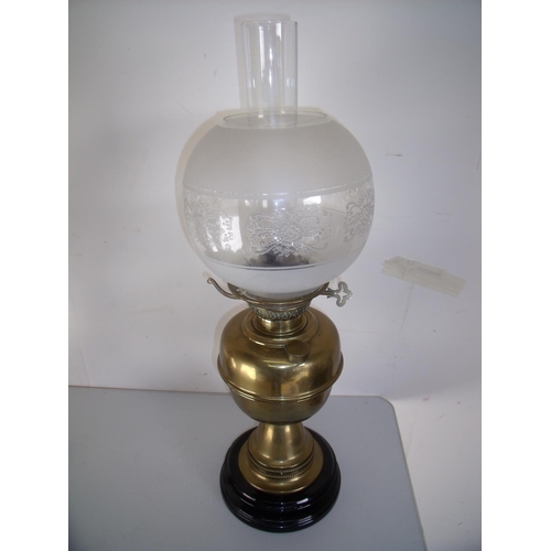 55 - Early 20th brass oil lamp on turned base with etched glass shade