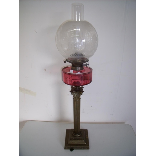 58 - 19th/20th C brass Corinthian column oil lamp with cranberry glass reservoir etched glass shade on sq... 