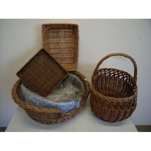 67 - Wicker work dog basket with liner and three other wicker baskets