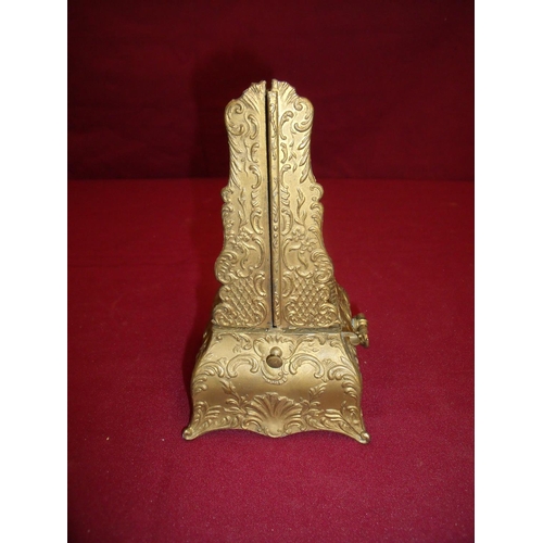 100 - Unusual Victorian cased gilt metal finished metronome with two folding doors (19cm high)