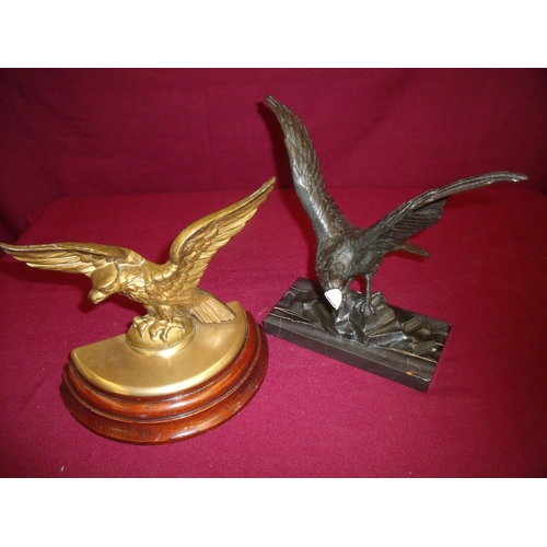 102 - Door stop in the form of a eagle on stepped wooden base and another desk stand in the form of an eag... 