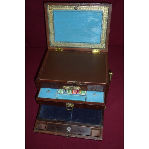 107 - Regency leather bound table box with stepped square central panelled ledge with engraved brass carto... 