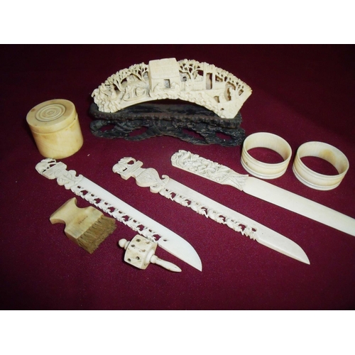 116 - Group of early 20th C carved ivory items including turned dressing table jar, napkin rings, spinning... 