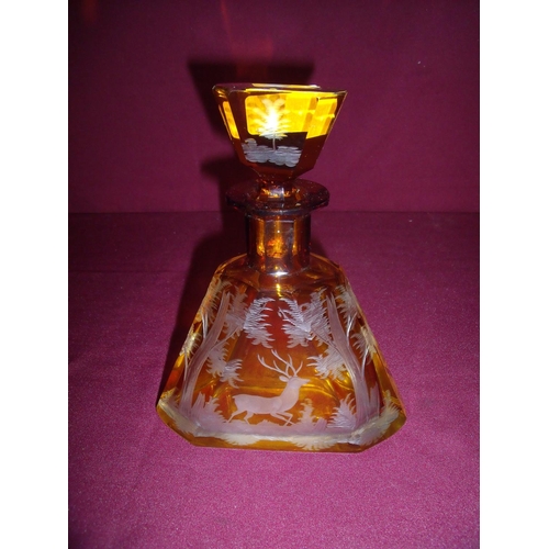 40 - Large clear and amber etched glass scent bottle of square tapering form depicting a stag in woodland... 