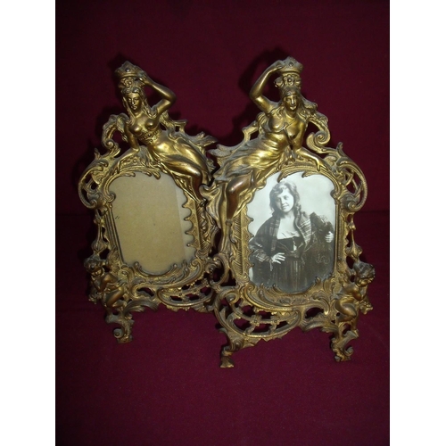 43 - Pair of Art Nouveau style gilt metal photograph frames with swing easel support, the frames decorate... 
