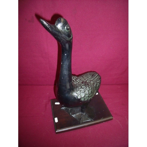 52 - Large early 20th C Japanese iron sculpture of a goose on rectangular wooden plinth (50cm high)