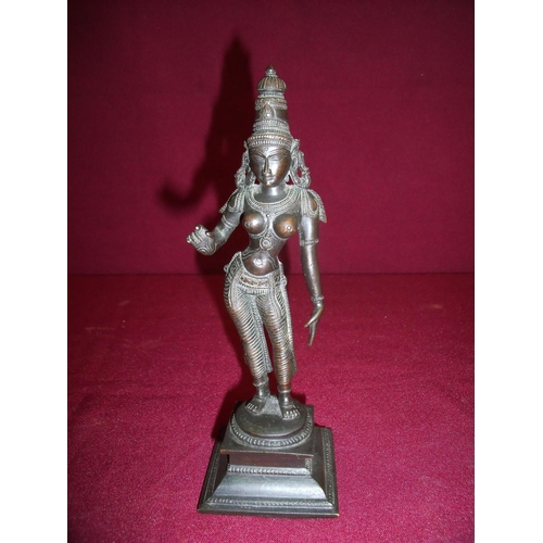 63 - Bronze Hinduism figure of a female deity on raised stepped square base (20cm high)