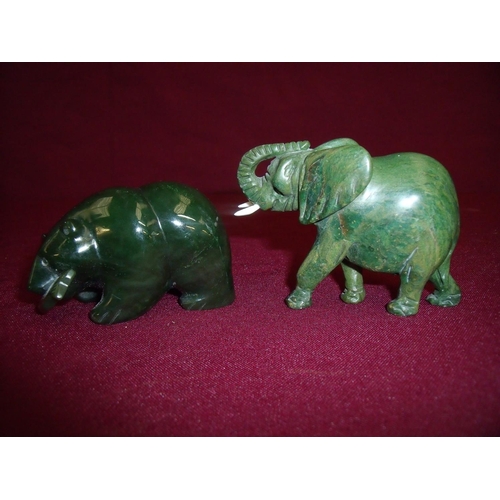 71 - Small carved hard stone figure of an elephant (6cm high) and another green hard stone carved figure ... 