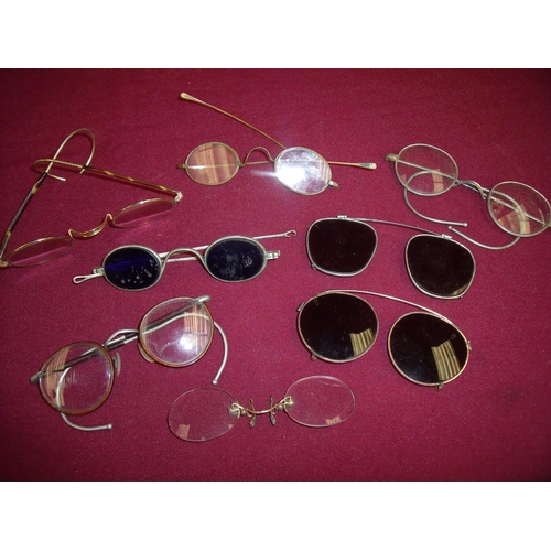 76 - Collection of 19th/20th C spectacles of various designs and form including some in yellow metal fram... 