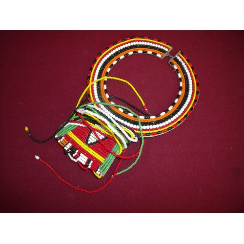 86 - African tribal beadwork necklace mounted on hide backing