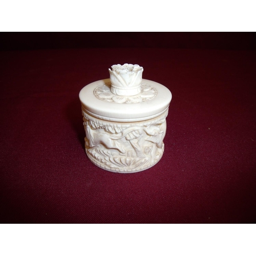 92 - Early 20th C Indian carved ivory circular table box with straw lid central figure of a flower, the b... 