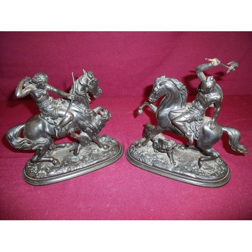 95 - Pair of 19th C cast iron figures of mounted male and female warriors fighting jaguars on oval bases ... 