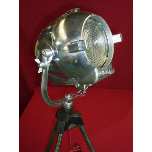 97 - Circa 1960s polished steel stage spotlight mounted on later stand with modern electric wiring, marke... 